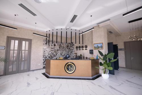 a lobby with a reception desk in a building at Astana Palace in Gori