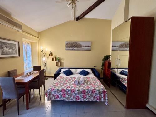 a bedroom with a bed and a table and a desk at Wonderful Como in Como