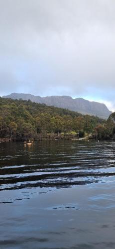 a large body of water with mountains in the background at Tullah HideAway in Tullah