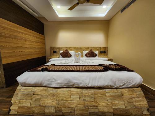 a bedroom with a large bed in a room at Arcadian Hotel in Gangtok