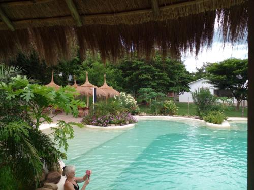 a woman and a child standing in a swimming pool at Luxux Ferienwohnung Indepedencia Casa Blanca No.3 in Independencia