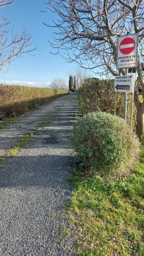 a road with a no parking sign on the side at Oleandro Cottage with garden in La Cinquantina