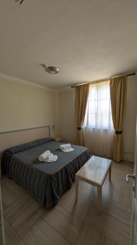 Letto o letti in una camera di Onda Marina Residence Rta