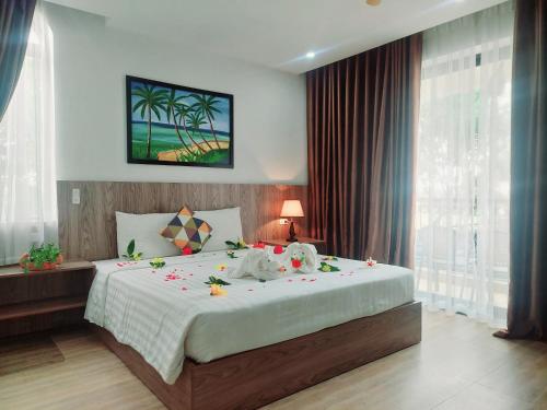 Postel nebo postele na pokoji v ubytování An Villa Beach Paradise