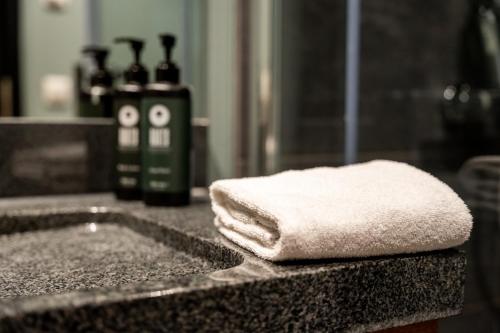 a pile of white towels sitting on top of a counter at Restaurant Hotel Zum Storchen in Waldkirch
