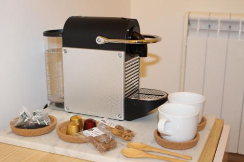 a kitchen counter with a toaster and some food at Bruc & Bruc in Barcelona