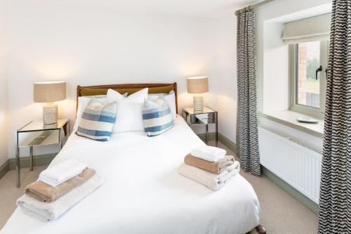 Katil atau katil-katil dalam bilik di Barn Conversion in North Petherton