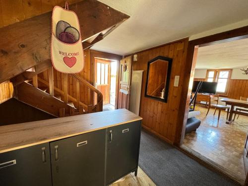 a kitchen and living room in a log cabin at AlpenHaus, farmhouse in Triesenberg