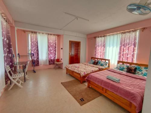 Ένα ή περισσότερα κρεβάτια σε δωμάτιο στο Eleba Guesthouse