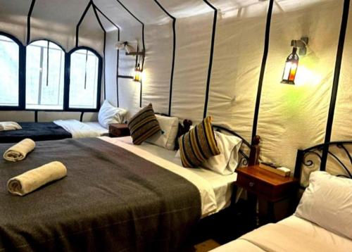 Letto o letti in una camera di Merzouga Luxury Camp