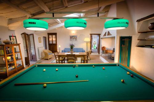 a pool table in the middle of a living room at Podere Felceto in Panzano