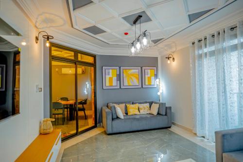 a living room with a couch and a table at RESIDENCE ISABELLA in Douala