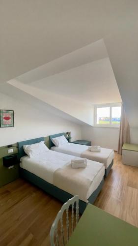 Ένα ή περισσότερα κρεβάτια σε δωμάτιο στο Huma BnB