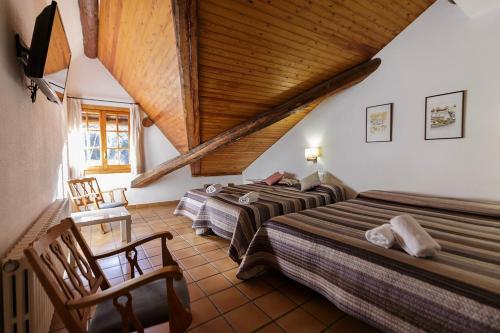 Postel nebo postele na pokoji v ubytování HOTEL LAMOGA