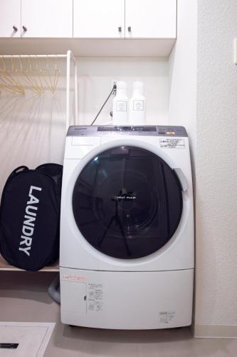 a white microwave sitting on top of a counter at L -scene Centrally located in Matsumoto Maximum 8 people 2 min walk from Matsumoto Castle in Matsumoto