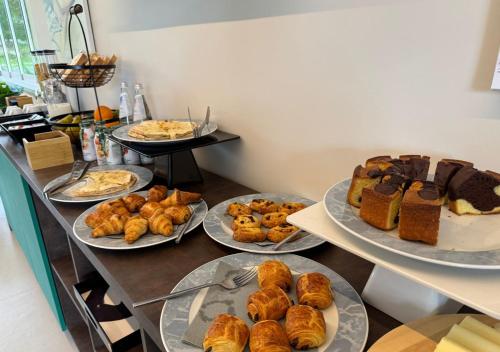 a buffet line with different types of pastries and desserts at Tenuta San Marco in Noto