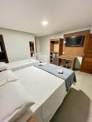Ένα ή περισσότερα κρεβάτια σε δωμάτιο στο Hotel Pepita