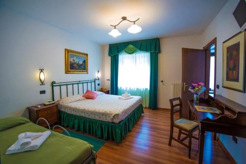 Postel nebo postele na pokoji v ubytování Albergo Le Macinaie - Monte Amiata