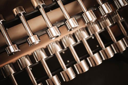 a bunch of metal knobs on a wine rack at Lusina Apartments in Luson