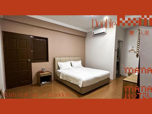 Postel nebo postele na pokoji v ubytování Mana Mana Hotel • Melaka •