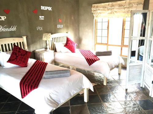 Ένα ή περισσότερα κρεβάτια σε δωμάτιο στο Hadida Guesthouse