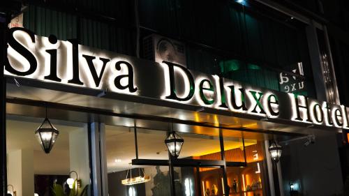 a sign that reads sika delivey on a store at SİLVA DELUXE Hotel in Mezitli