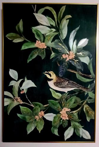 a bird is sitting on a tree branch at The Cozy Glass House by the Sea in Bauang
