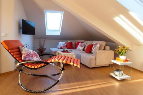 a living room with a couch and a chair at Apartments Anuška in Cavtat