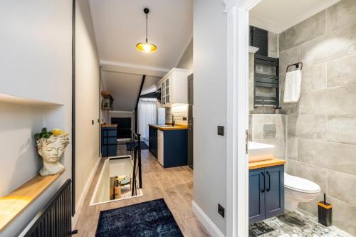 a small bathroom with a toilet and a sink at Respiro Rooms in Istanbul