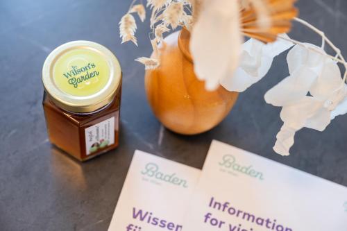 a jar of mustard next to a vase with flowers at WILSON's Home Baden City Center Forestview in Baden
