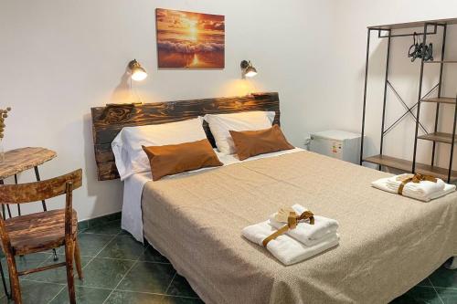 Postel nebo postele na pokoji v ubytování Big Fish Alghero Guesthouse