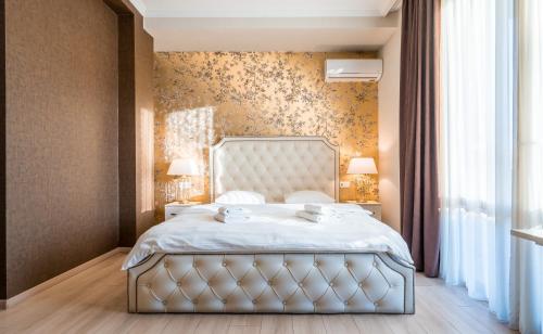 Postel nebo postele na pokoji v ubytování Rivendell Boutique Hotel Tbilisi City