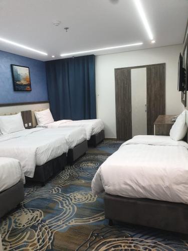 Katil atau katil-katil dalam bilik di Luluat EL-Sharq Makkah Hotel فندق لؤلؤة الشرق بمكة