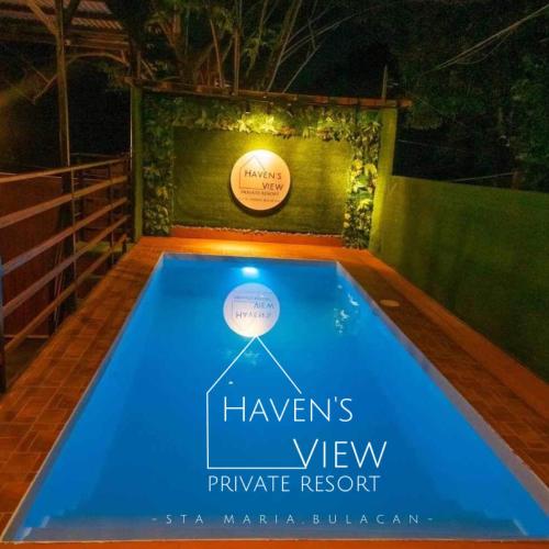 a swimming pool with a sign that reads hawsers view private resort at Haven's View Private Resort in Santa Maria