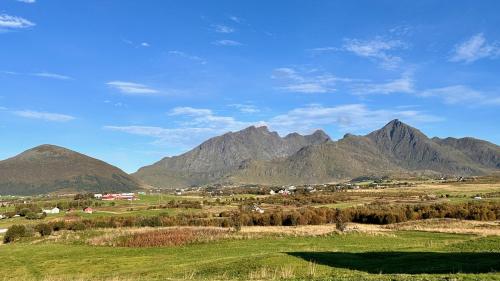 a view of a valley with mountains in the background at Charming house with exceptional view in Vestvågøya