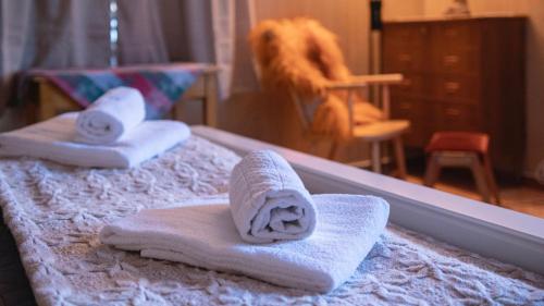 two towels on two beds in front of a mirror at Charming house with exceptional view in Vestvågøya
