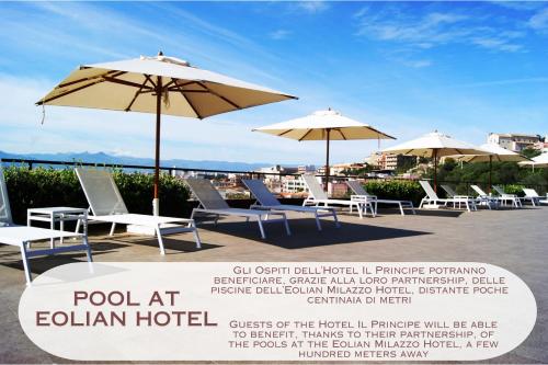 a group of chairs and umbrellas on a patio at Hotel Il Principe in Milazzo