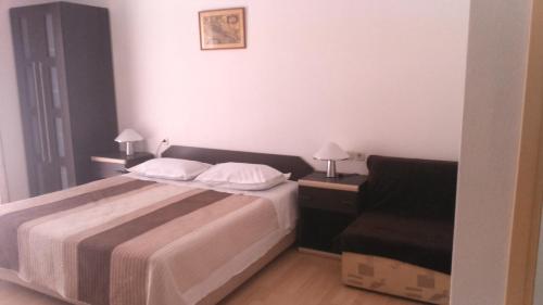 Кровать или кровати в номере Apartments Lorenco