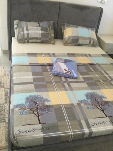 Un pat sau paturi într-o cameră la Oasis métropole