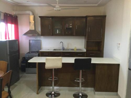 O bucătărie sau chicinetă la Oasis métropole