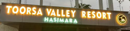 a sign on a building with the words tokyo valley records at Hasimara River View Home Stay in Hāsimāra