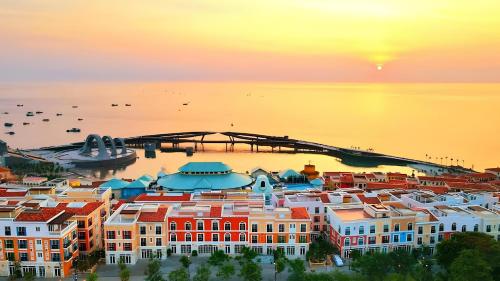 an aerial view of a city at sunset at Sun Bay Hotel Phu Quoc in Phu Quoc
