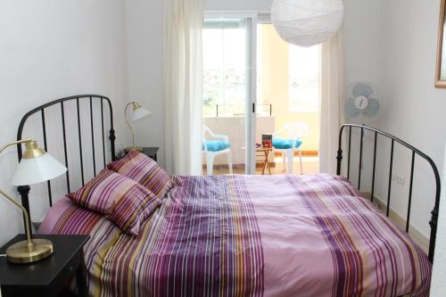 Katil atau katil-katil dalam bilik di Sea Views Appartment Almerimar 2D