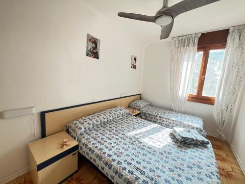 Postel nebo postele na pokoji v ubytování Condominio Splendid