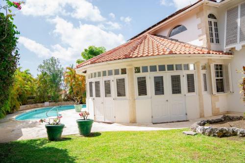 a house with a garage and a swimming pool at Marzalea 5 Bd Villa by ZenBreak in Saint James