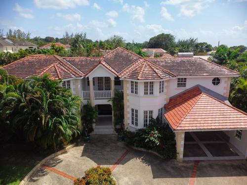 an aerial view of a white house with an orange roof at Marzalea 4 bd Villa by ZenBreak in Saint James