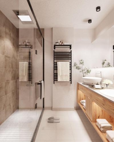 a bathroom with a shower and a sink at Hotel Kristall in Grossarl