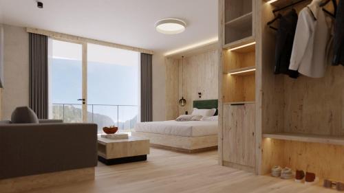 a bedroom with a bed and a large window at Hotel Kristall in Grossarl