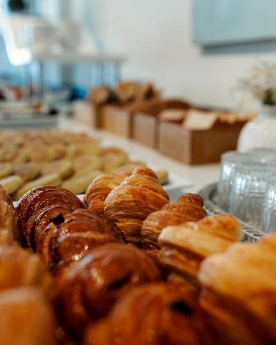 a bunch of donuts on display in a bakery at MIA Urban Fès in Fès