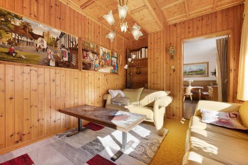 a living room with a couch and a table at La casa delle Fate in Roncone